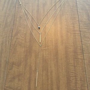Three-tiered gold toned drop necklace